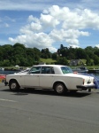 The driver of the wedding car kills time down by the river